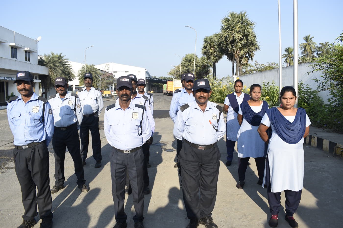 BSS guards and support staff standing together at an industrial site